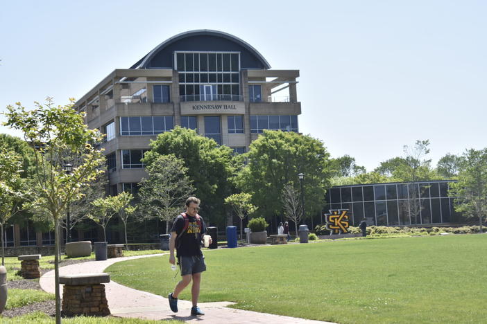 A student walks the Kennesaw State University Campus. Universities like Kennesaw allow high school students to sign up for college level classes.