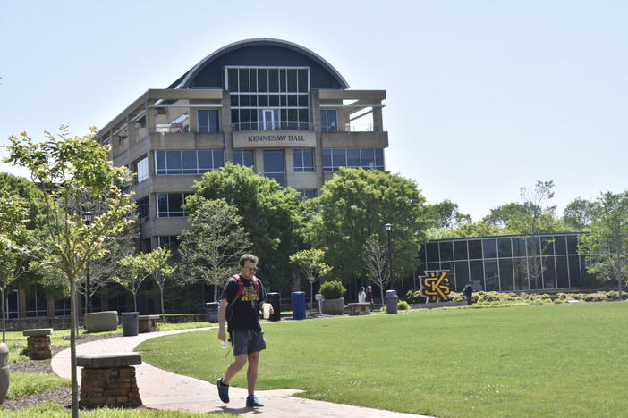 A student walks the Kennesaw State University Campus. Universities like Kennesaw allow high school students to sign up for college level classes.