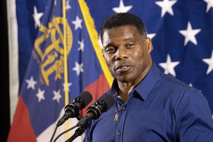 Republican candidate for U.S. Senate Herschel Walker speaks during a campaign stop at the Governors Gun Club, Dec. 5, 2022, in Kennesaw, Ga. Walker's wife is seeking to sell the Atlanta house that Walker listed as a residence during his Senate run. 