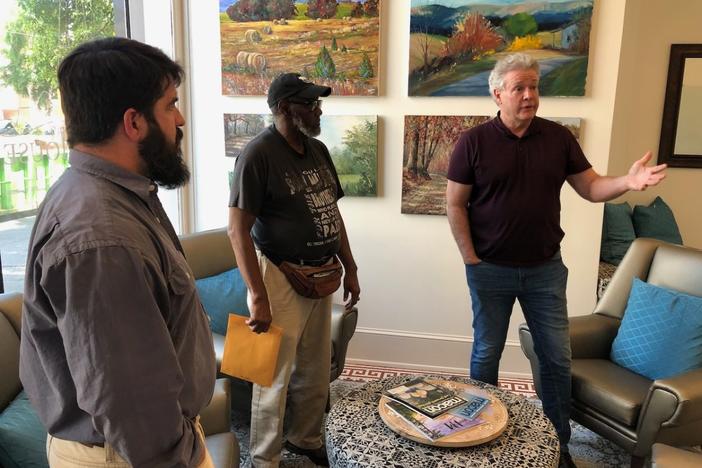 Actor and playwright Michael O’Leary, right, discusses his play “Breathing Under Dirt” with Joshua Hale, left, and Newton Collier at the Griffith Foundation headquarters on Mulberry Street in April.