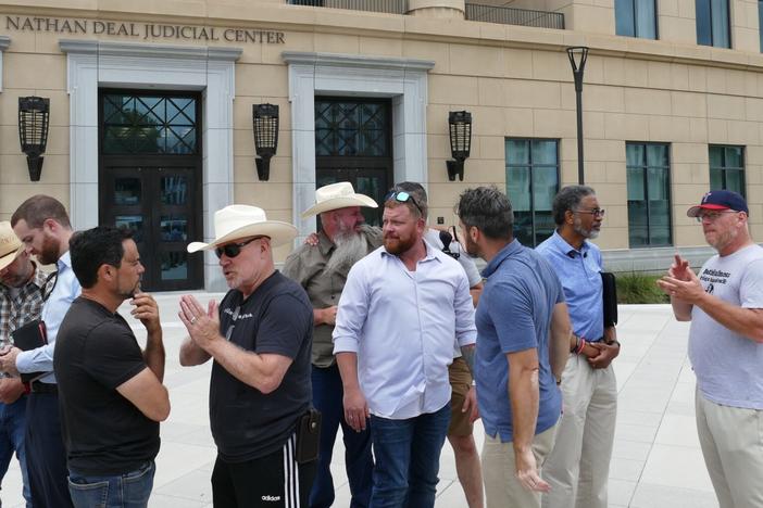 The men of Operation Save America close out the group’s weeklong anti-abortion protest in front of the Nathan Deal Judicial Center in Atlanta, Georgia