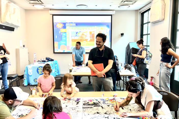 Children coloring with author 