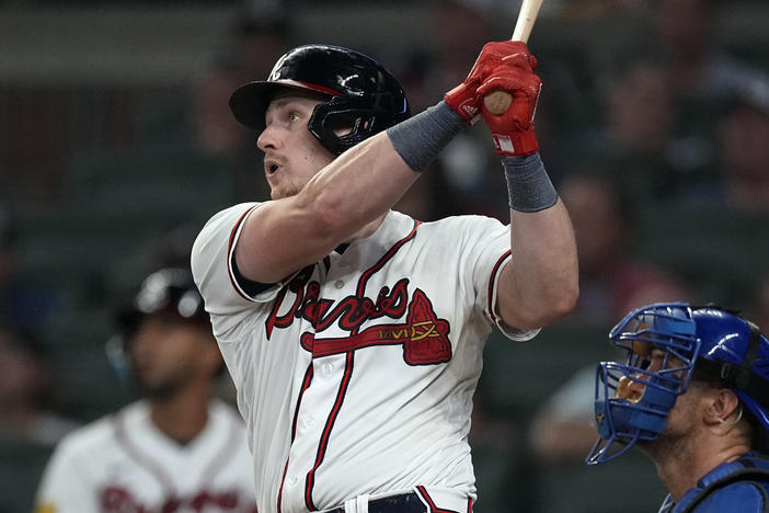 Atlanta Braves' Sean Murphy hits a flyball in the eighth inning of a baseball game against the Chicago Cubs, Tuesday, Sept. 26, 2023, in Atlanta. Chicago Cubs right fielder Seiya Suzuki misplayed allowing two runs to score.