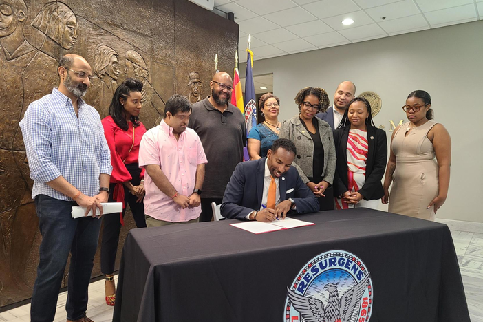 Atlanta Mayor Andre Dickens signs the Inclusive Language and Actions Administrative Order at a press conference Sept 8, 2023.