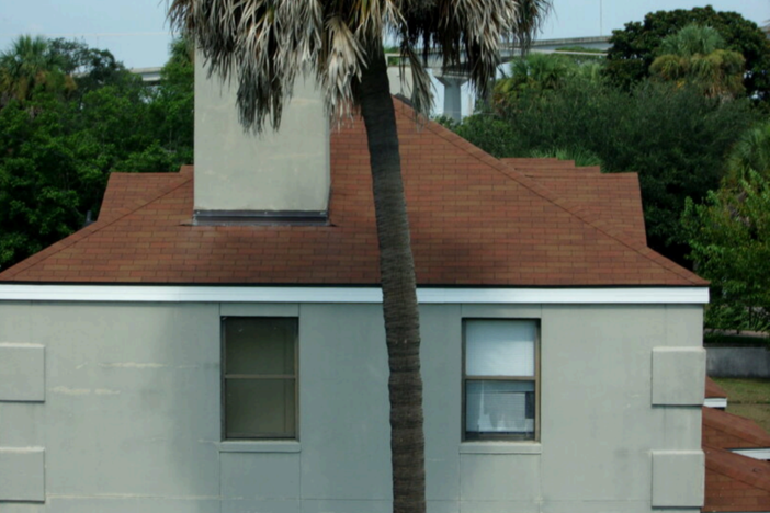 An apartment building at Yamacraw Village in Savannah is seen with asphalt shingle roofing, which was installed in 2019 and noted by AEI Consultants as the only significant capital expenditure undertaken at the public housing complex in the past five years.