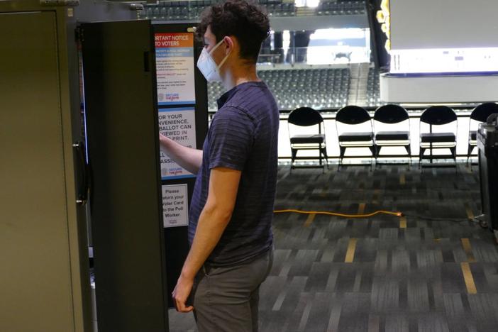 A student casts his ballot at Georgia Tech’s McCamish Pavilion in the 2021 Senate runoff. 