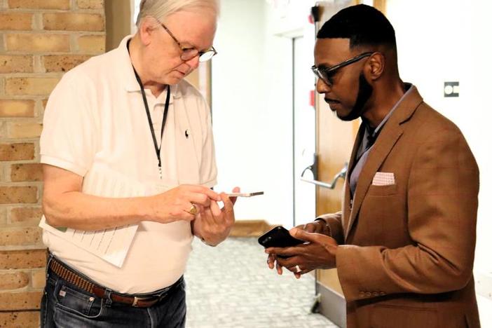 Pastor Bob Farrow of St. Nicholas Episcopal in Hamilton, Georgia and Pastor Willie J. Barber II of Prospect A.M.E. meet and share contact information at the Green Team Summit.  