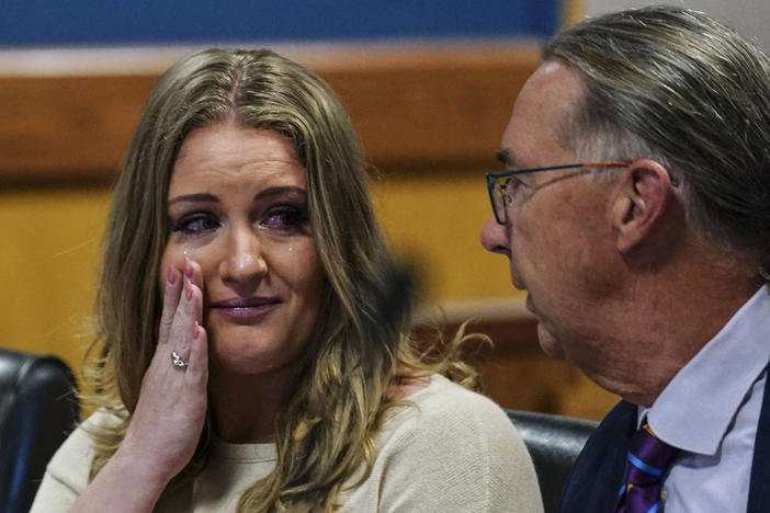 Jenna Ellis speaks with her attorney Franklin Hogue after Ellis plead guilty to a felony count of aiding and abetting false statements and writings, inside Fulton Superior Court Judge Scott McAfee's Fulton County Courtroom, Tuesday, Oct. 24, 2023, in Atlanta. Ellis, an attorney and prominent conservative media figure, reached a deal with prosecutors Tuesday, Oct. 24, 2023, and pleaded guilty to a reduced charge over efforts to overturn Donald Trump's 2020 election loss in Georgia.