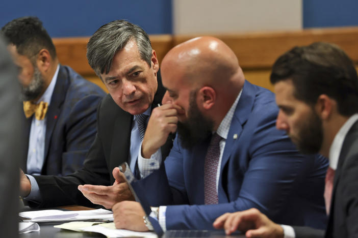 Kenneth Chesebro, left, confers with is lawyer Scott Grubman, as Judge Scott MacAfee presides as the lawyers of Sidney Powell and Chesebro appear during a motions hearing in the election subversion case Tuesday, Oct. 10, 2023, in Atlanta.