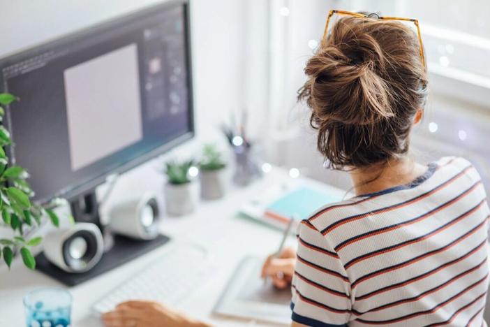 woman sitting at a desk