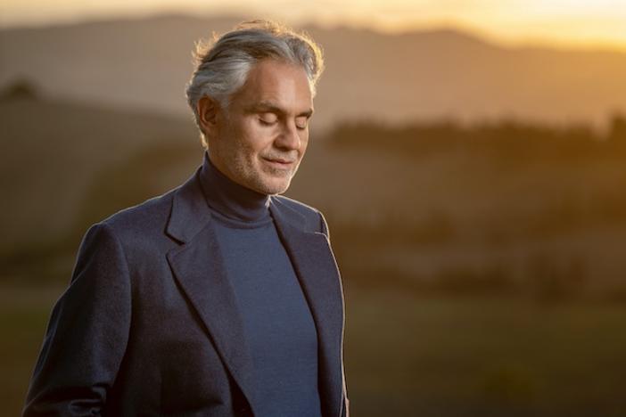 Andrea Bocelli standing outdoors.