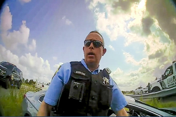 A still image from a deputy’s body camera video provided by the Camden County Sheriff's Office shows Staff Sgt. Buck Aldridge following a chase and arrest on June 24, 2022.
