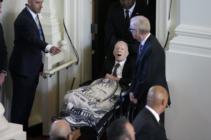 Former President Jimmy Carter, arrives to attend a tribute service for his wife and former first lady Rosalynn Carter, at Glenn Memorial Church, Tuesday, Nov. 28, 2023, in Atlanta. 