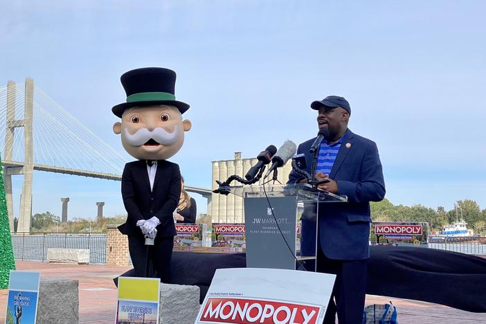 Accompanied by “Mr. Monopoly,” Savannah Mayor Van Johnson speaks at an event along the city's downtown riverfront on Tuesday, Nov. 14, 2023, to reveal the new Savannah edition of Monopoly.