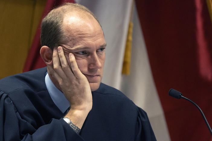 FILE - Judge Scott McAfee presides over a hearing for Harrison Floyd at the Fulton County Courthouse, Nov. 3, 2023, in Atlanta. McAfee is set to hear arguments on a request to revoke the bond of Harrison Floyd, one of former President Donald Trump's codefendants in the Georgia case related to efforts to overturn the 2020 election. Fulton County District Attorney Fani Willis last week filed a motion asking McAfee to revoke the bond of Floyd. (Christian Monterrosa/Pool Photo via AP, File)