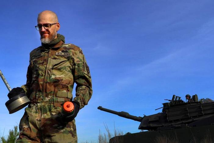 Jay Tenison, a military veteran currently fighting Stage IV stomach cancer, fires a tank Tuesday afternoon at Fort Moore, Georgia. 