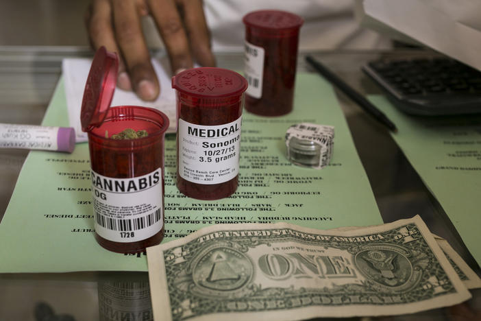 Medical marijuana prescription vials are filled at a medical marijuana dispensary in Venice, Calif., May 14, 2013. The U.S. Drug Enforcement Administration on Nov. 27, 2023, warned pharmacies in Georgia to not dispense medical marijuana products despite state permission to become the first pharmacies nationwide to do so.