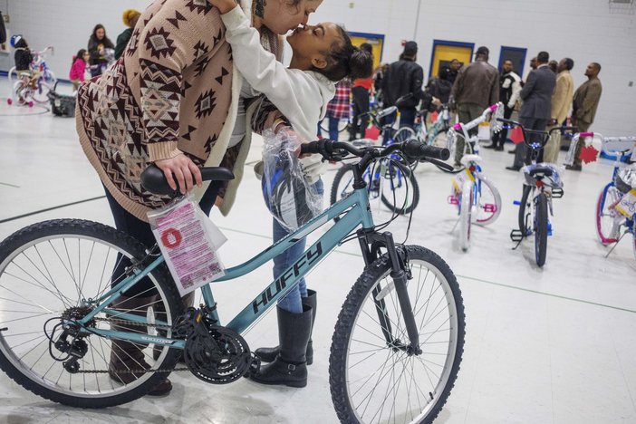 On Dec. 19, 2023, Jaimie Hatton sends her daughter Tylyanna back to class at Bruce Elementary School in Macon after Tylyanna was one of around 40  students given new bicycles for Christmas by the Middle Georgia chapter of 100 Black Men.