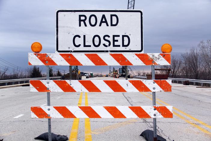 A sign reading "ROAD CLOSED"