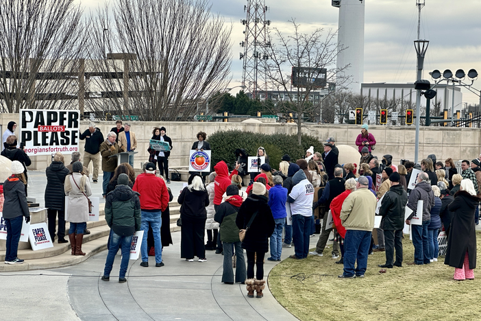 Protesters from Georgiansfortruth.org, a group advocating for paper-ballot voting, gathered outside the Georgia Capitol as state lawmakers met for the first day of the legislative session on Jan. 8, 2024.