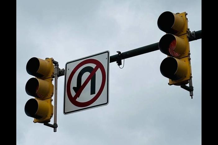An image of a traffic light flashing a yellow signal. 