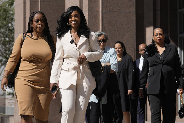 Arian Simone, second left, one of the co-founders and CEOs of The Fearless Fund, walks out of the James Lawrence King Federal Building following a hearing, Wednesday, Jan. 31, 2024, in Miami.