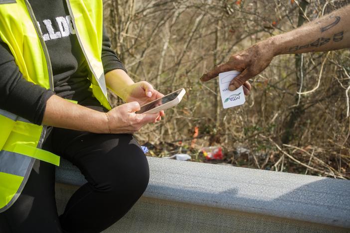 Heather Sims conducts a phone based app interview and needs assessment with a man who, by his account, has been homeless his entire life. 