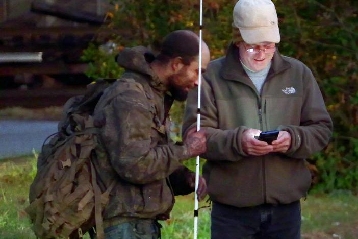 Charles Jeffries, Community Data Manager at the United Way of the Chattahoochee Valley, right, surveys a man experiencing homelessness during the 2024 Point in Time Count.