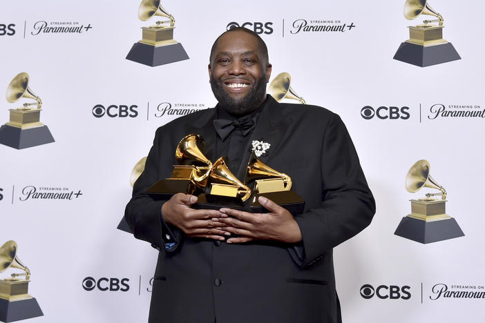 Killer Mike poses in the press room with the awards for best rap performance and best rap song for "Scientists & Engineers," and best rap album for "Michael" during the 66th annual Grammy Awards on Sunday, Feb. 4, 2024, in Los Angeles.