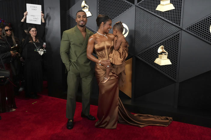 John Gaines, from left, Victoria Monet, and Hazel Monet Gaines arrive at the 66th annual Grammy Awards on Sunday, Feb. 4, 2024, in Los Angeles. 