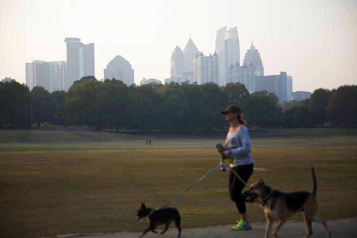 In this Nov. 14, 2016, file photo, a haze hovers over the Atlanta midtown skyline from a wildfire burning in the Northwest part of the state.