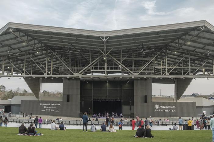 The amphitheater can accomodate 12,000 people, mostly through expansive green space and covered seating. 