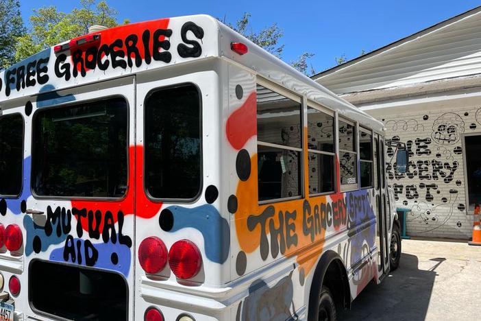The Grocery Spot is written in Black spray paint on the side of a white bus. Mutual aid is written on the back. has been offering free groceries from their Atlanta store since 2021. Now they're asking for more donations and volunteers to serve more people.