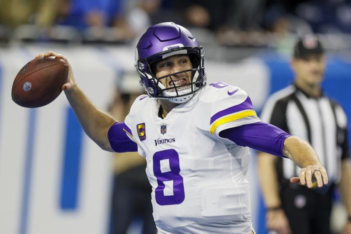 Minnesota Vikings' Kirk Cousins throws during the first half of an NFL football game against the Detroit Lions, Dec. 11, 2022, in Detroit. Cousins is leaving Minnesota for Atlanta, landing another big contract with a well-timed foray into free agency. Cousins' agent Mike McCartney announced on social media that his client has agreed to a four-year deal with the Falcons. 