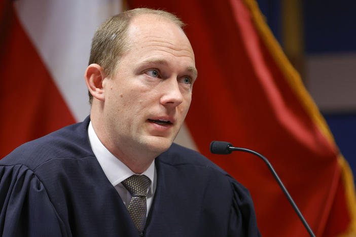 Fulton County Superior Judge Scott McAfee presides over a hearing is to determine whether Fulton County District Attorney Fani Willis should be removed from the case because of a relationship with Nathan Wade, special prosecutor she hired in the election interference case against former President Donald Trump, Friday, March, 1, 2024, in Atlanta.
