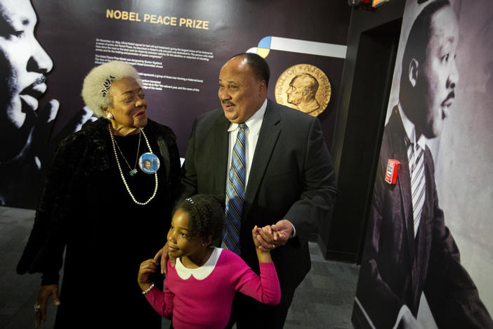 Martin Luther King III, right, the son of Rev. Martin Luther King Jr., walks with his daughter Yolanda, and Naomi King, left, the wife of Rev. King's brother, A.D., through an exhibition devoted to the awarding of the Nobel Peace Prize to King at the Martin Luther King Jr. Historical Site, Wednesday, Dec. 10, 2014, in Atlanta. Civil rights activist Naomi Barber King died Thursday, March 7, 2024, in Atlanta, according to family members. She was 92. 