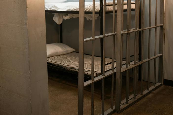 view inside of a generic jail cell with bunk bed