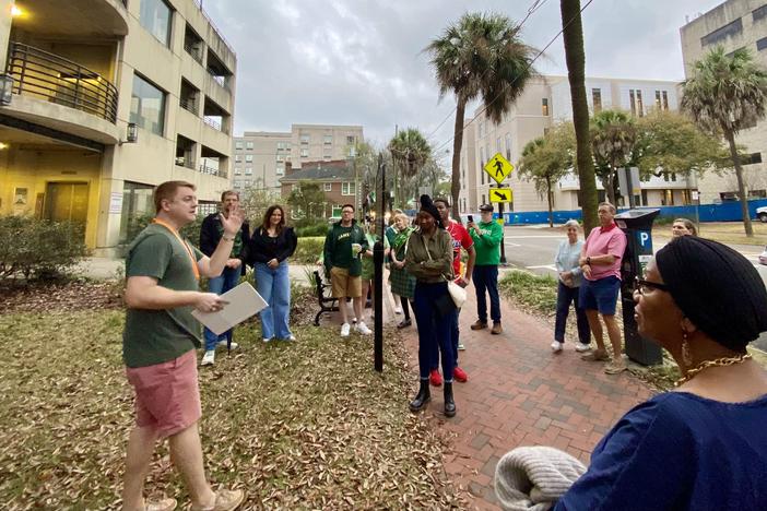 Brandon Carter, far left, begins a historical tour in downtown Savannah near the site of the now-gone St. John the Baptist Church, where Catholic Bishop John England ushered in the city's first public St. Patrick's Day parade on March 17, 1824.