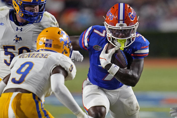 Florida running back Trevor Etienne, right, tries to get past McNeese State defensive back Jadden Matthews (9) during the first half of an NCAA college football game, Saturday, Sept. 9, 2023, in Gainesville, Fla. Georgia running back Trevor Etienne was arrested early Sunday, March 24, 2024, on drunken driving, reckless driving and other charges, jail records show.
