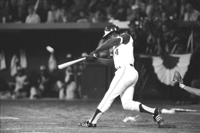 tlanta Braves' Hank Aaron hits his 715th career home run in Atlanta Stadium, April 8, 1974, to break the all-time record set by the late Babe Ruth. The ball is a blur as it leaves the bat.