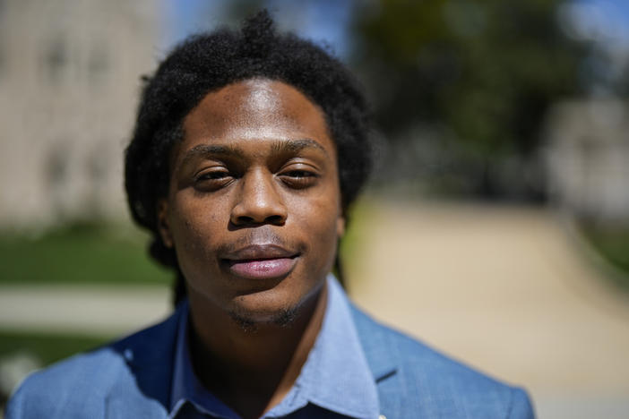 Davante Jennings poses for a photo at the state Capitol, Thursday, March 28, 2024, in Atlanta. Not long ago, Jennings was not even an active voter. He had given up on politics after the 2016 presidential election, his first time voting. But he was targeted by the New Georgia Project ahead of the 2022 elections and now helps reach out to would-be voters. 
