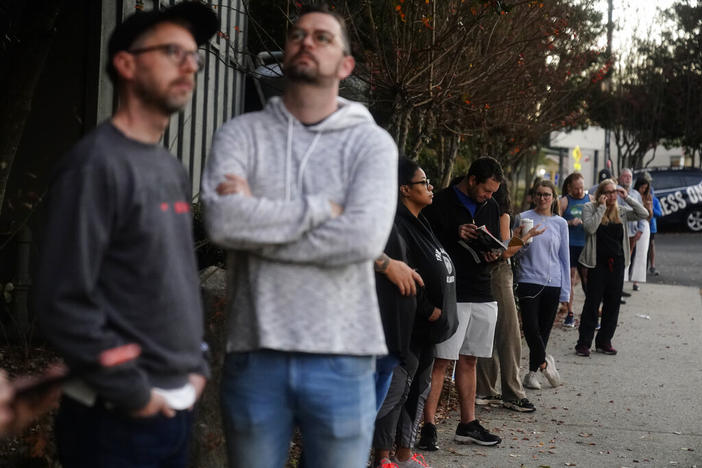 People wait in line to vote on Election Day, Nov. 8, 2022, in Atlanta.