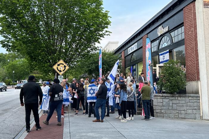 About 50 Jewish and Israeli community members gathered in front of Ali’s Cookies in Emory Village on April 25.
