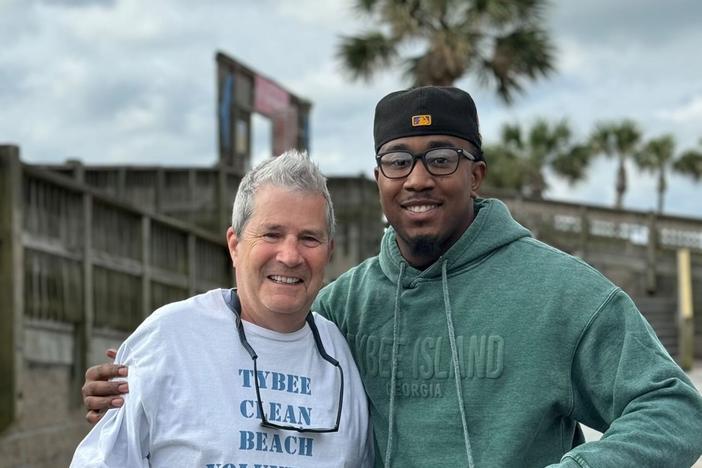 Savannah activist and volunteer Jaydon Grant, right, poses for a photo with Fight Dirty Tybee organizer Tim Arnold during a beach cleanup on Tybee Island after this year's Orange Crush gathering.