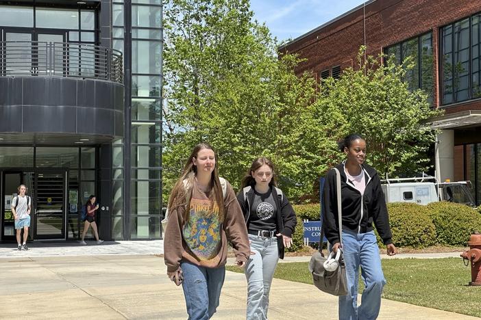 Students walk across the Gordon State College campus on Tuesday, April 16, 2024, in Barnesville, Ga. Regents of the University System of Georgia voted in a meeting at Gordon State to raise tuition and mandatory fees beginning in fall 2024.