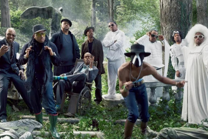 Dungeon Family members (from left to right) Pat "Sleepy" Brown, Antwan "Big Boi" Patton, Big Rube, Ray Murray, T-Mo, Andre "3000" Benjamin (in mask), Khujo, Big Gipp, Cee-Lo and Rico Wade (seated).