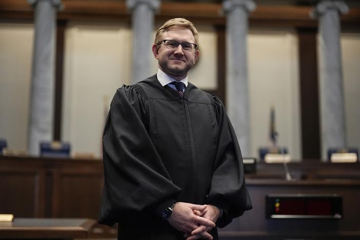Supreme Court Justice Andrew Pinson poses for a photo, Wednesday, April 17, 2024, in Atlanta. Ga. Republican Gov. Brian Kemp announced Tuesday, May 14, 2024 that his political committee would spend $500,000 to support Pinson in his nonpartisan election race against John Barrow in a nonpartisan election for Supreme Court Justice, in May. 