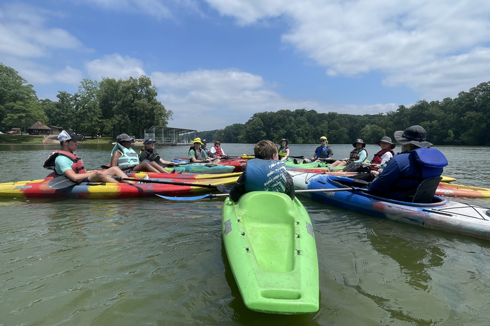 People kayaking.