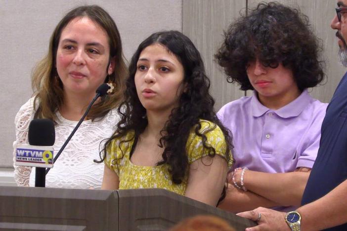 Ella Velez, center, speaks during a Thursday afternoon press conference at Piedmont Columbus Regional Hospital in Columbus, Georgia. With her are her mother, Lorna Velez, brother Alex Velez, and father Luis Velez.