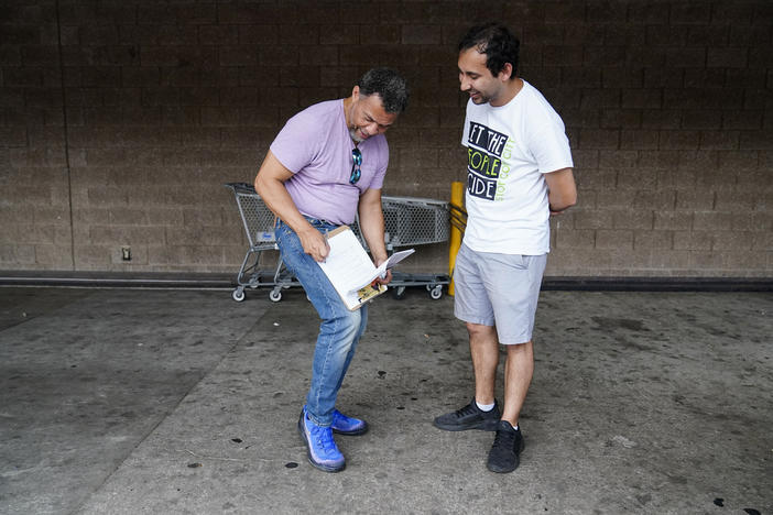 Gabriel Sanchez, right, seeks signatures trying to force a referendum to decide the fate of a proposed police and firefighter training center on Thursday, July 20, 2023, in Atlanta. Sanchez won a Democratic state House primary on Tuesday, May 21, 2024, beating incumbent Teri Anulewicz. 